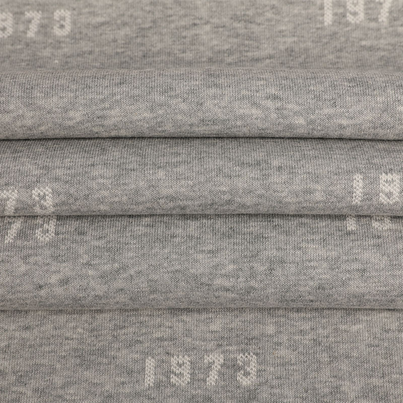 32s Celese + 100D/36F resirkulert polyester + 10s Celese Jacquard Fleecestoff